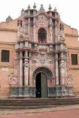 A detailed facade of the Church of Santa Cruz with ornate architectural elements.
