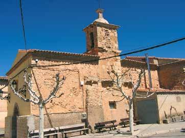 Exterior view of the Church of Santa Maria with a bell tower and surrounding trees.