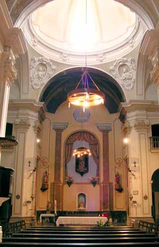 Interior view of the Church of San Cugat, showcasing its architecture and altar.