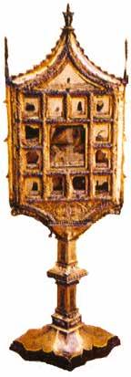 A golden monstrance displaying relics associated with the Eucharistic miracle of Ivorra.