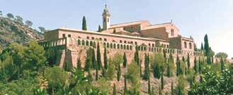A view of the church where the Eucharistic miracle occurred, surrounded by trees and hills.