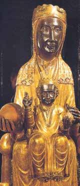 A golden statue of the Madonna and Child, depicting intricate details and religious significance.