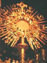 A golden monstrance with rays, used to display the Eucharistic host.
