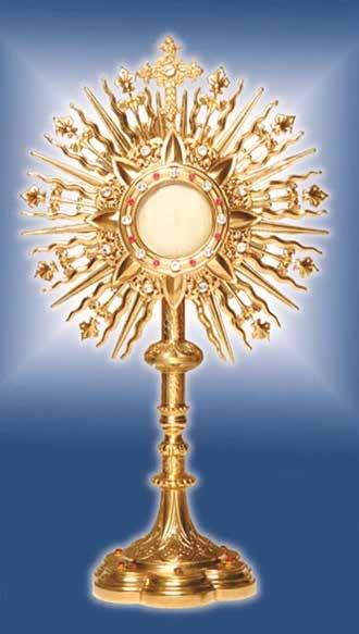 A golden monstrance displaying the consecrated Host at the center, surrounded by rays.