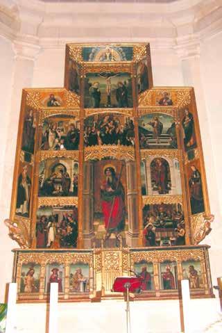 A large altarpiece with multiple religious scenes and figures depicted in vibrant colors.