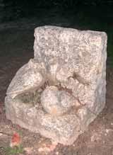 A stone relic depicting two birds and a nest, possibly related to the miracle's narrative.