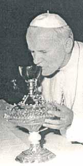 A pope drinking from a chalice, likely the Holy Grail of Valencia.