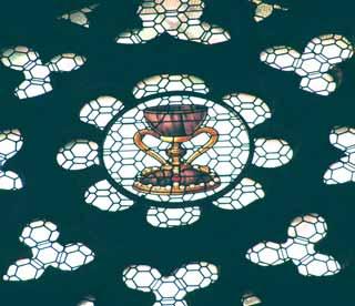 Stained glass depicting the Holy Grail, symbolizing the Eucharistic miracle in Valencia where wine turned to blood.